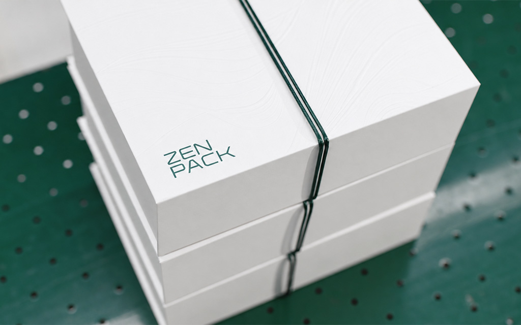 Premium rigid packaging system with blind embossing and foil stamping by Zenpack.
