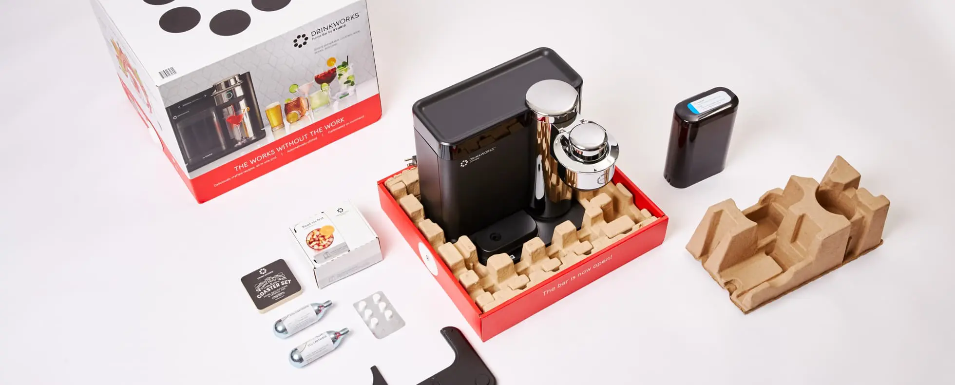 Drinkworks cocktail machine and accessories arranged with eco-friendly packaging produced by Zenpack