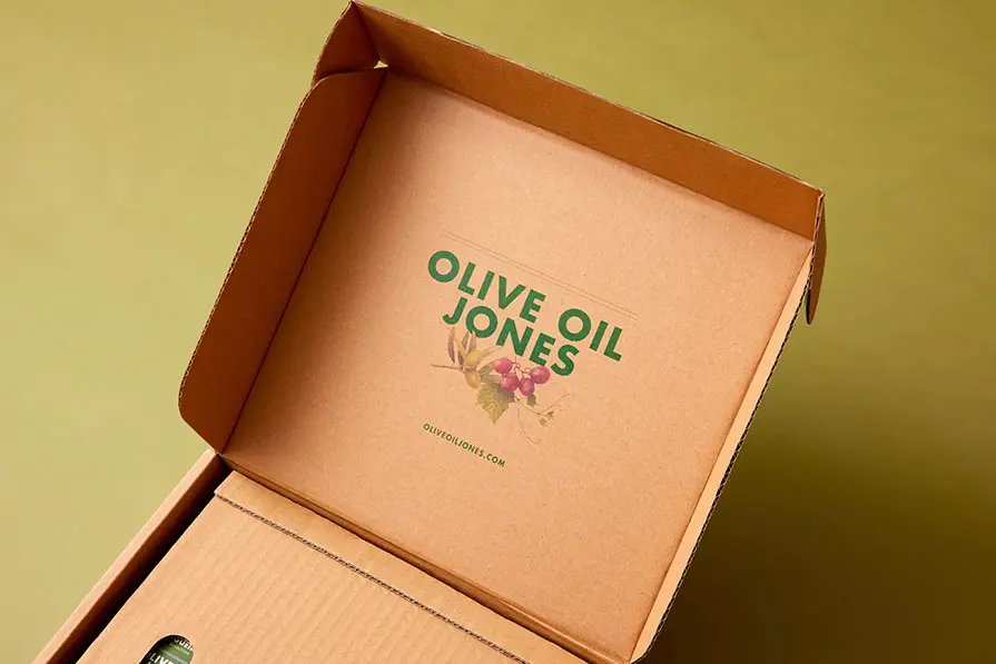 Olive Oil Jones package opened showing the company's logo