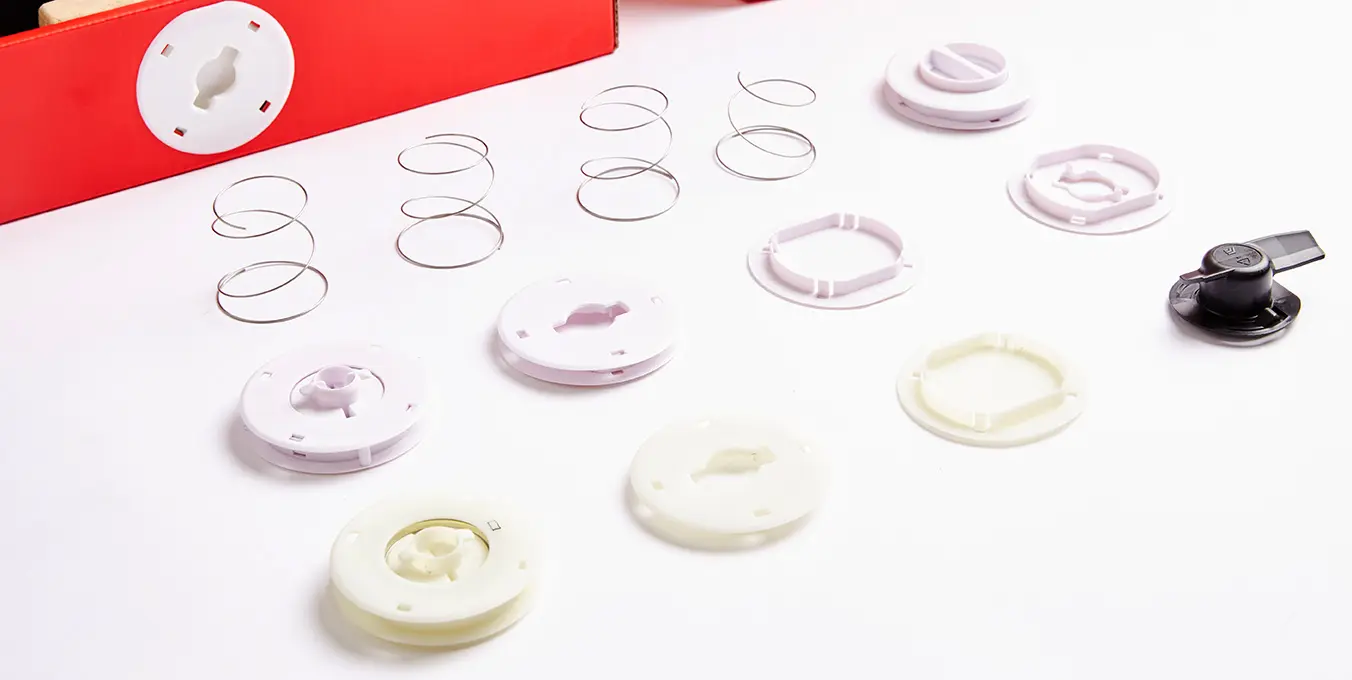 Various components of the Drinkworks beverage system spread out, showcasing the intricate switcher details
