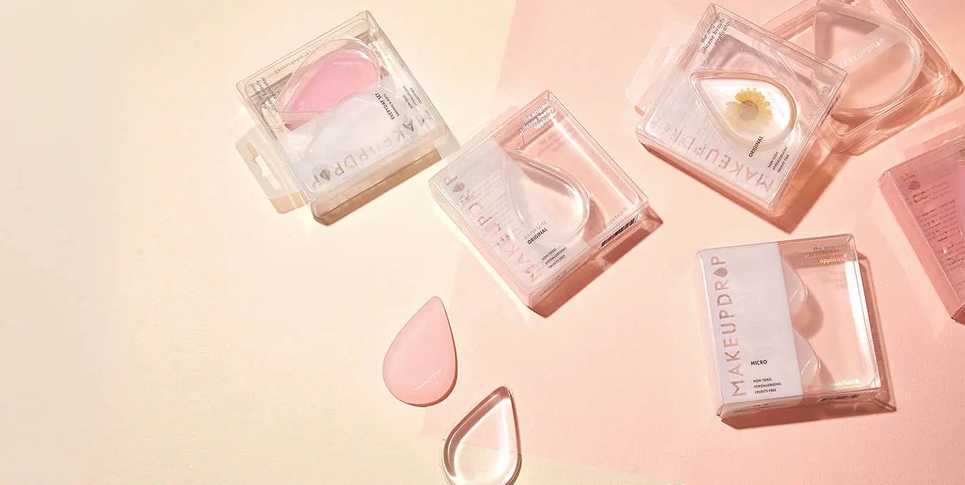 Custom liquid applicator packaging with clear blister boxes for MakeupDrop by Zenpack.