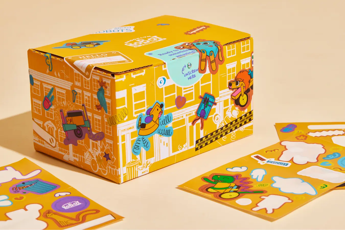 Vibrant educational toy packaging with playful robot graphics and stickers