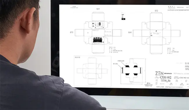 Engineer reviewing digital dieline for rapid prototyping packaging on computer screen