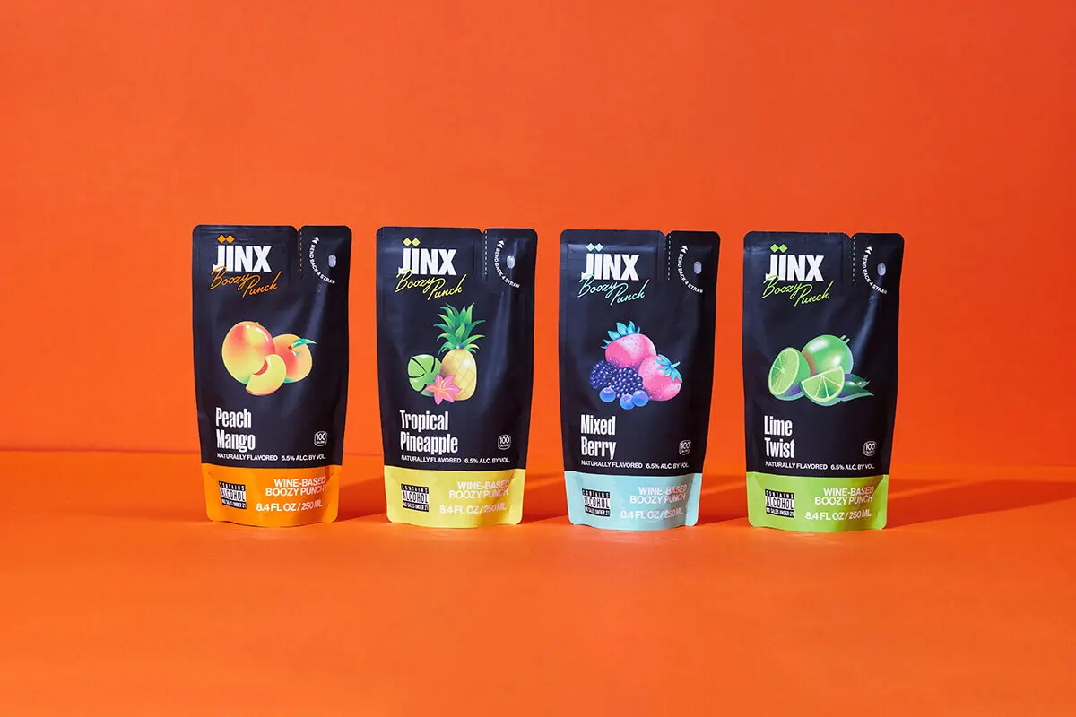 Four flavors of Jinx Boozy Punch flexible pouches designed by Zenpack, featuring Peach Mango, Tropical Pineapple, Mixed Berry, and Lime Twist.