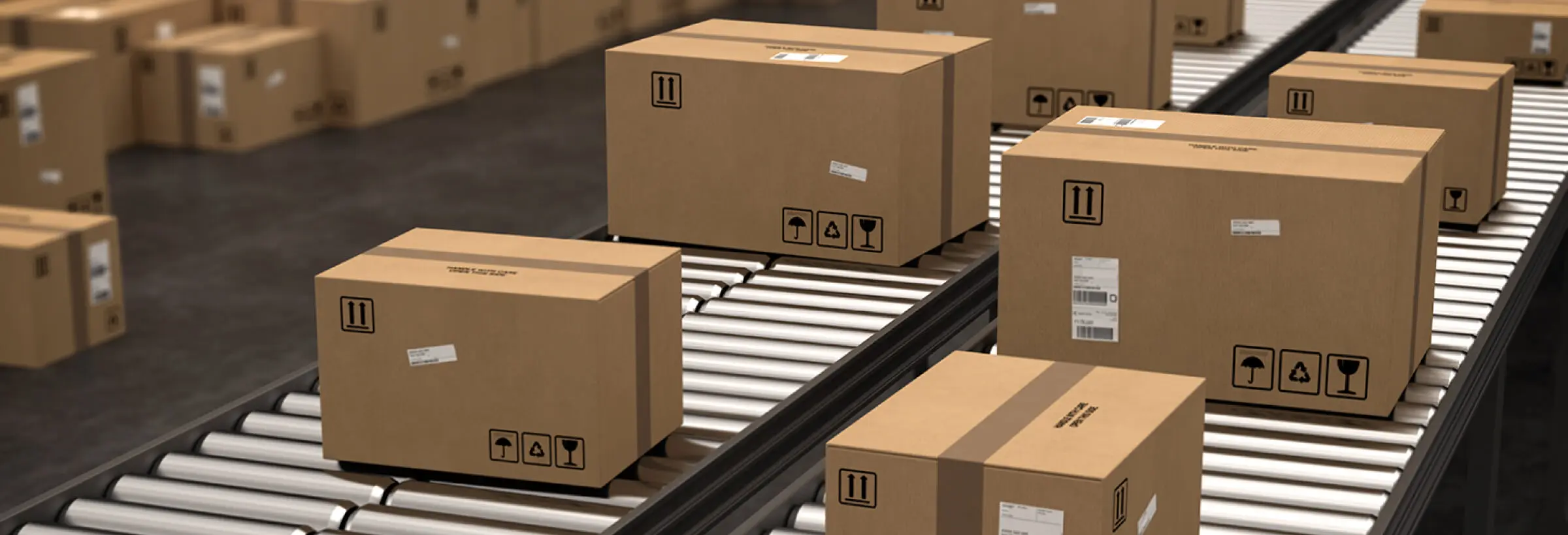 Corrugated cardboard boxes moving on warehouse conveyor belts for Zenpack packaging logistics services.