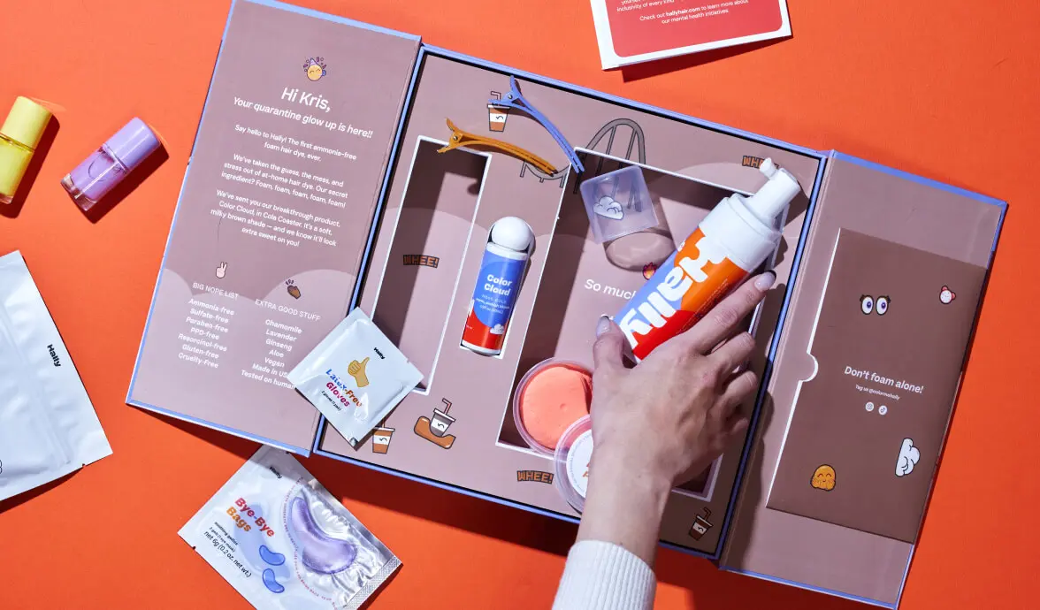 Custom multi-item beauty gift kit box with die-cut inserts and colorful packaging.