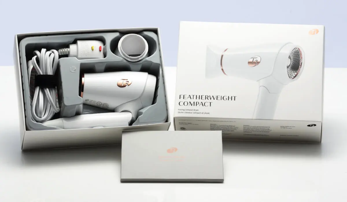 White T3 hair dryer and packaging box with structured internal tray for electronic product shipping protection.