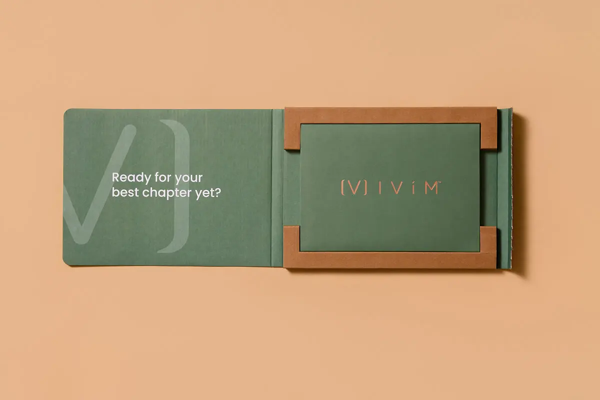 IVIM Health GLP-1 starter kit custom packaging design by Zenpack featuring a sage green folder with "Ready for your best chapter yet?" text and framed insert.