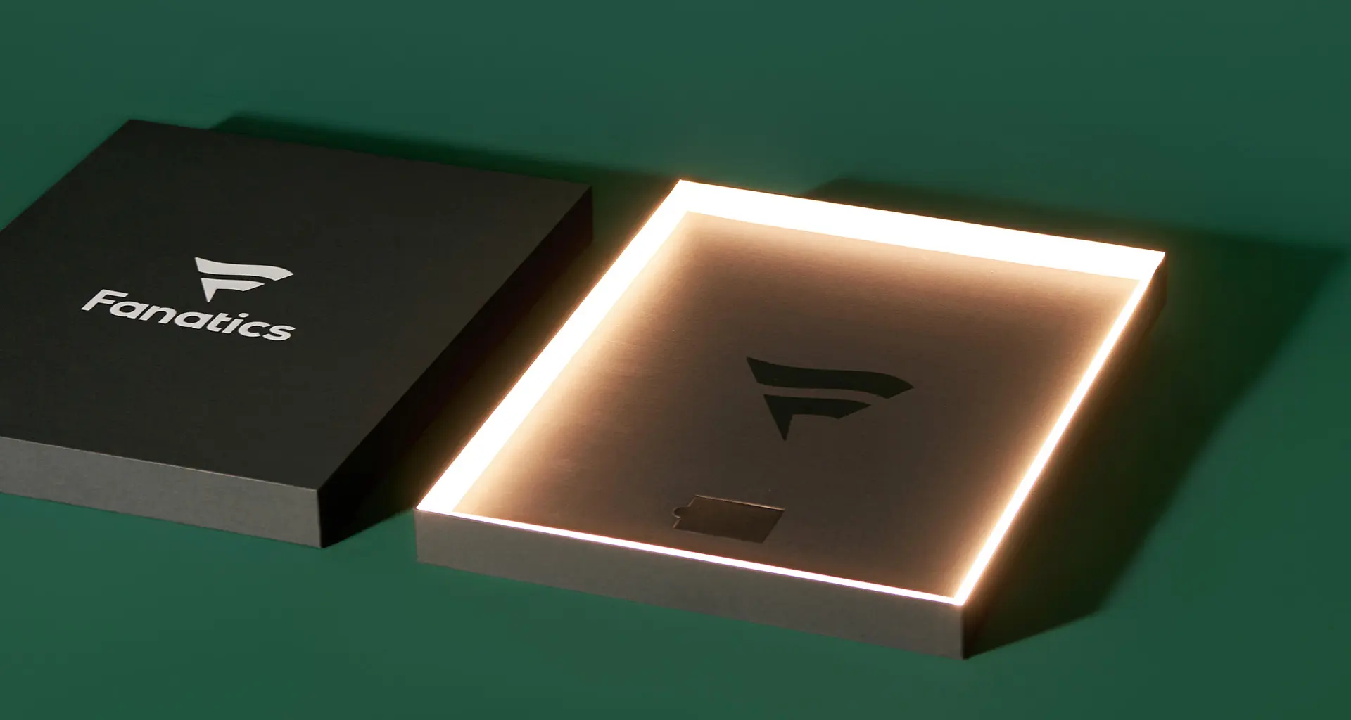 Fanatics luxury rigid box packaging featuring illuminated LED edge lighting engineered for premium brand experience.