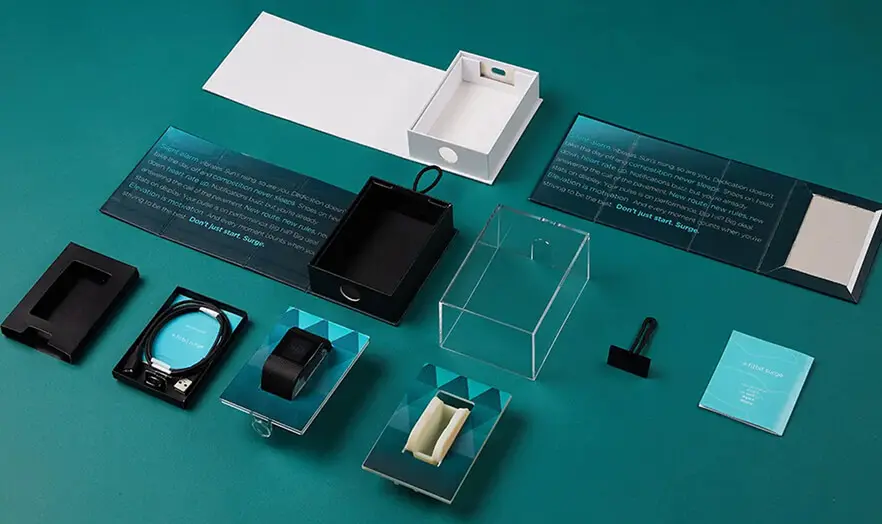 Freight packaging optimization for Fitbit Surge smartwatch kit maximizing container space efficiency.