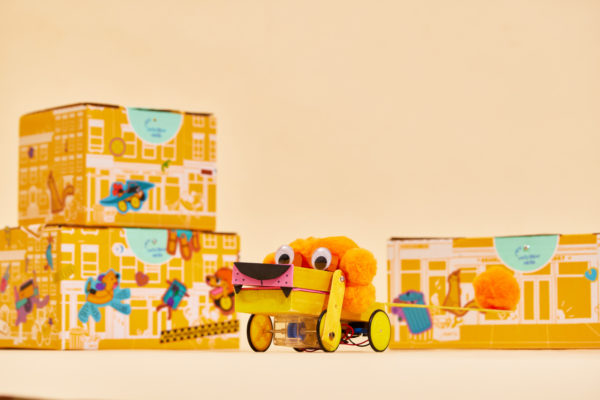 Brooklyn Robot Foundry toy with joyful design in front of Zenpack's vibrant packaging