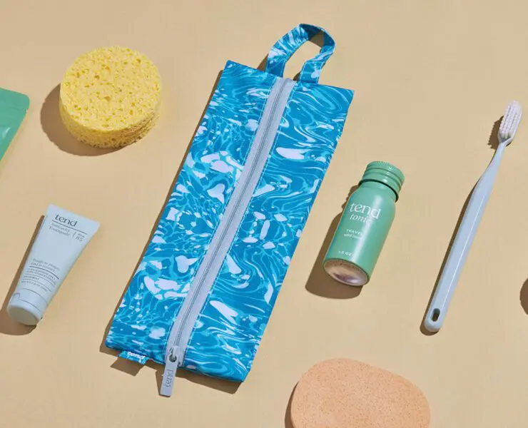 Arrangement of Tend oral care products with modern packaging on a warm background.